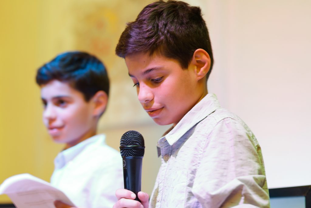 Boy making a speech at bar mitzvah party