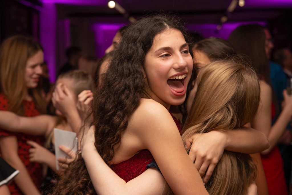 Girls hugging at a party