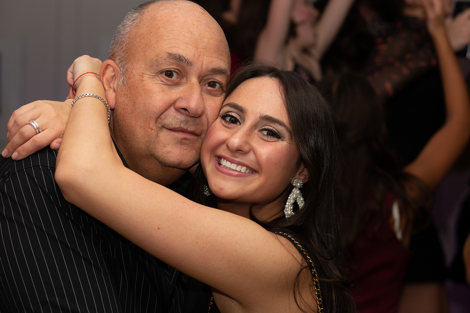 Woman hugging father at party