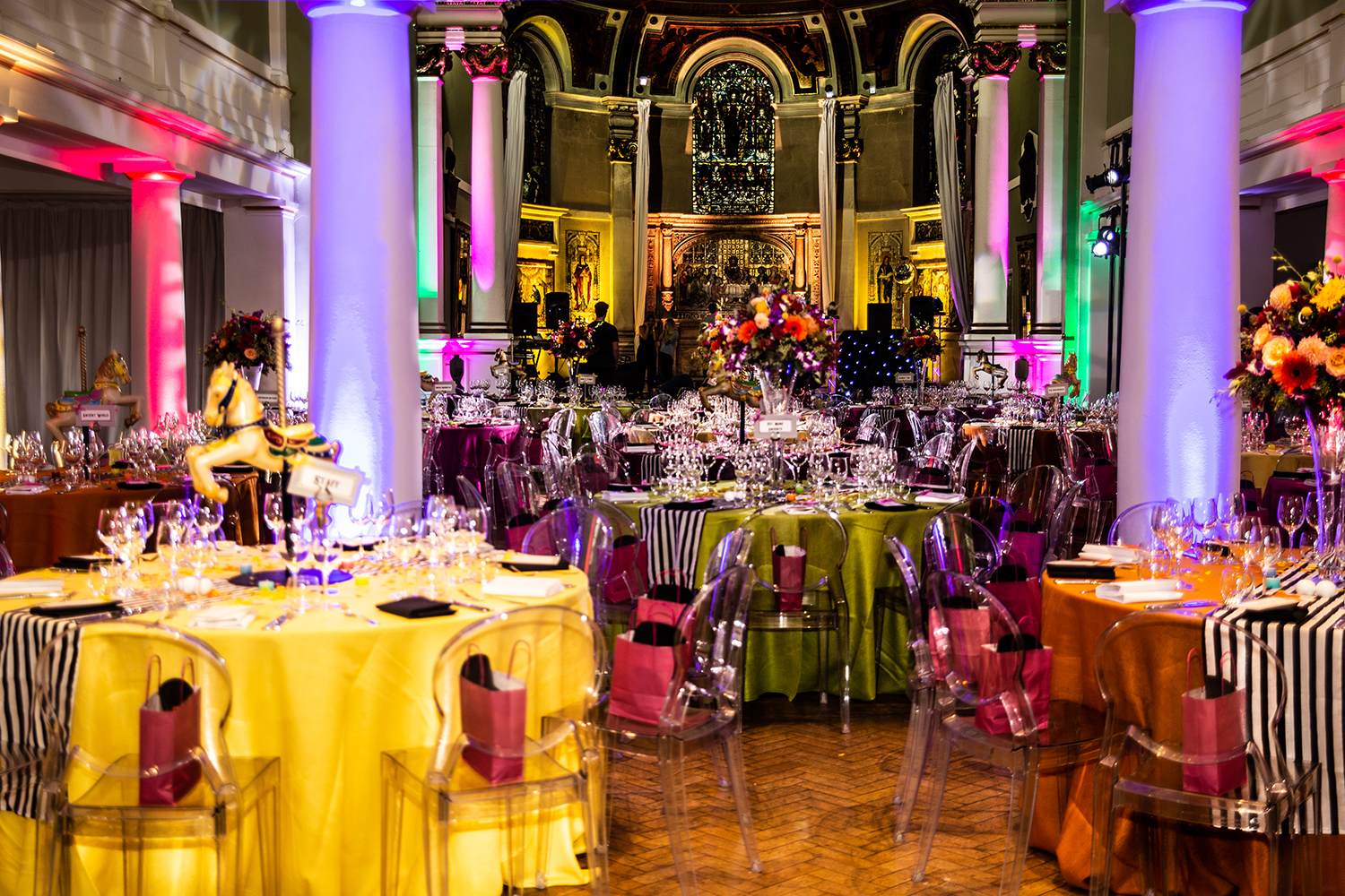 Huge party venue with colourful tables and decor
