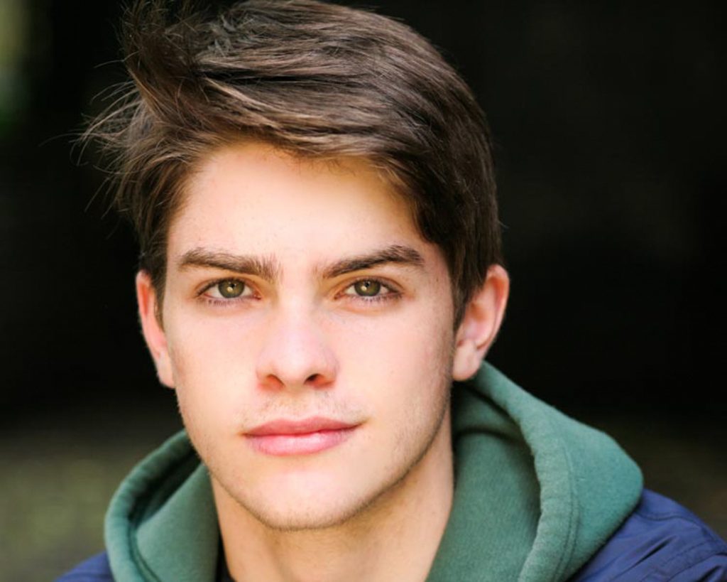 Young actor with green hoodie and green eyes