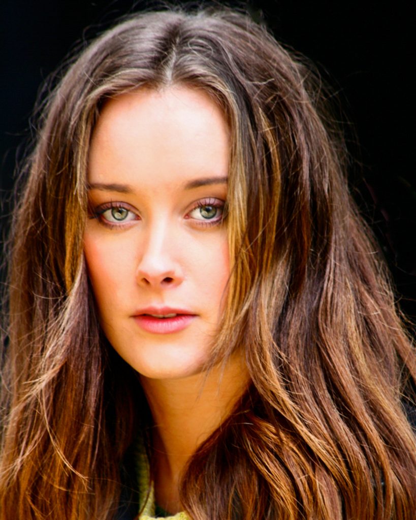 April Pearson actress with long hair and bright green eyes