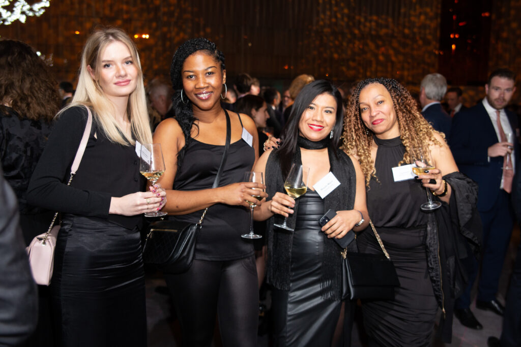 Four women at corporate event