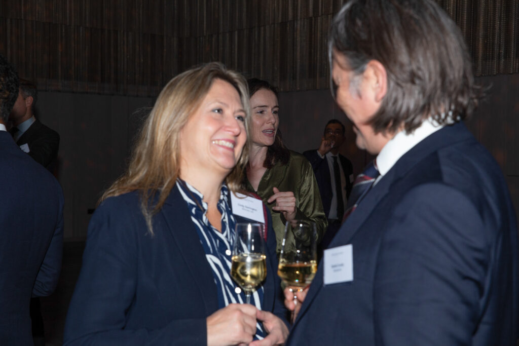 Woman and man chatting at corporate event